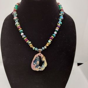 Glass and metal bead necklace with geode pendant